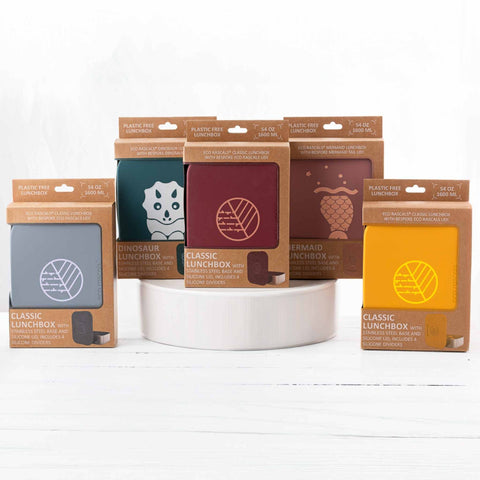 Image shows the Classic Burgundy Lunchbox by eco rascals with removable dividers and a stainless steel base in its packaging alongside the other 4 colour ways of Mustard, Silver, Dinosaur Teal and Mermaid Rose. 